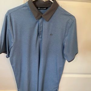 Travis Mathew blue golf shirt with grey color in Medium. Barely worn.